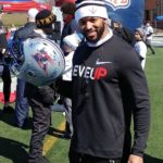 Daryl Townsend, defensive back for the Montreal Alouettes holds up an autographed Alouettes helmet.